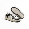 EWW Sports Shoes Alo Yoga Recovery Mode low-top sneakers in black and white with a cushioned sole and lace-up design.