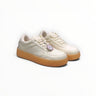EWW Sports Shoes Alo Yoga Recovery Mode low-top sneakers in beige with a gum rubber sole and minimalist design.