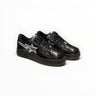 EWW Sports Shoes BAPE STA low-top sneakers in black patent leather with a silver star logo and lace-up closure.
