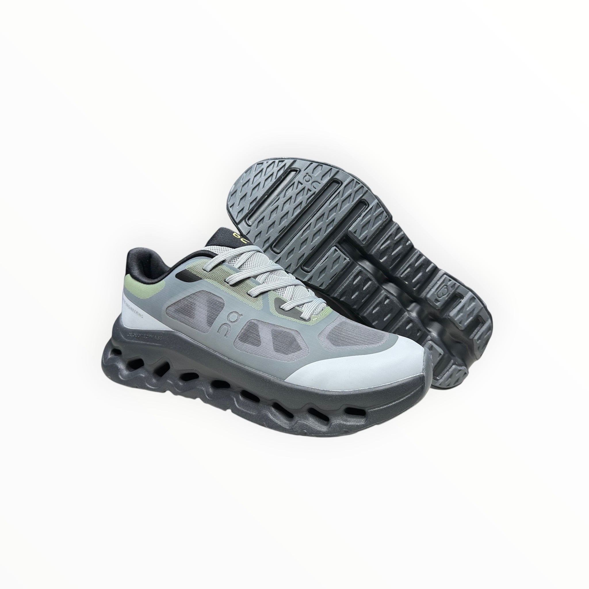 EWW Sports Shoes On Cloudtilt Remix grey and black running shoes with see-through x-ray effect upper and chunky sole.