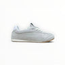 EWW Sports Shoes grey low-top suede sneakers with a minimalist design, white laces, and a gum rubber outsole.