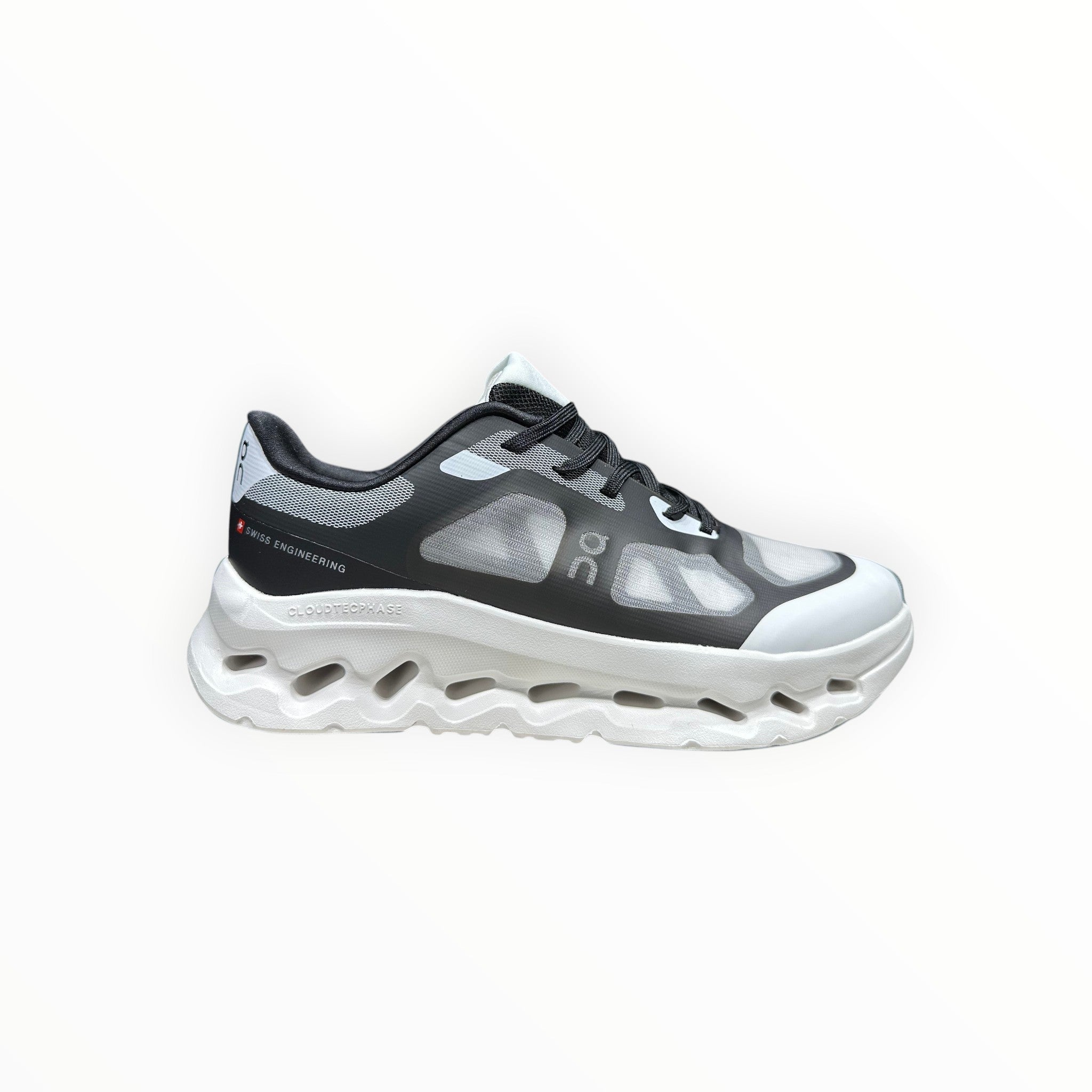 EWW Sports Shoes black and white On Cloudtilt Remix running shoes with see-through upper and unique CloudTec Phase cushioning.