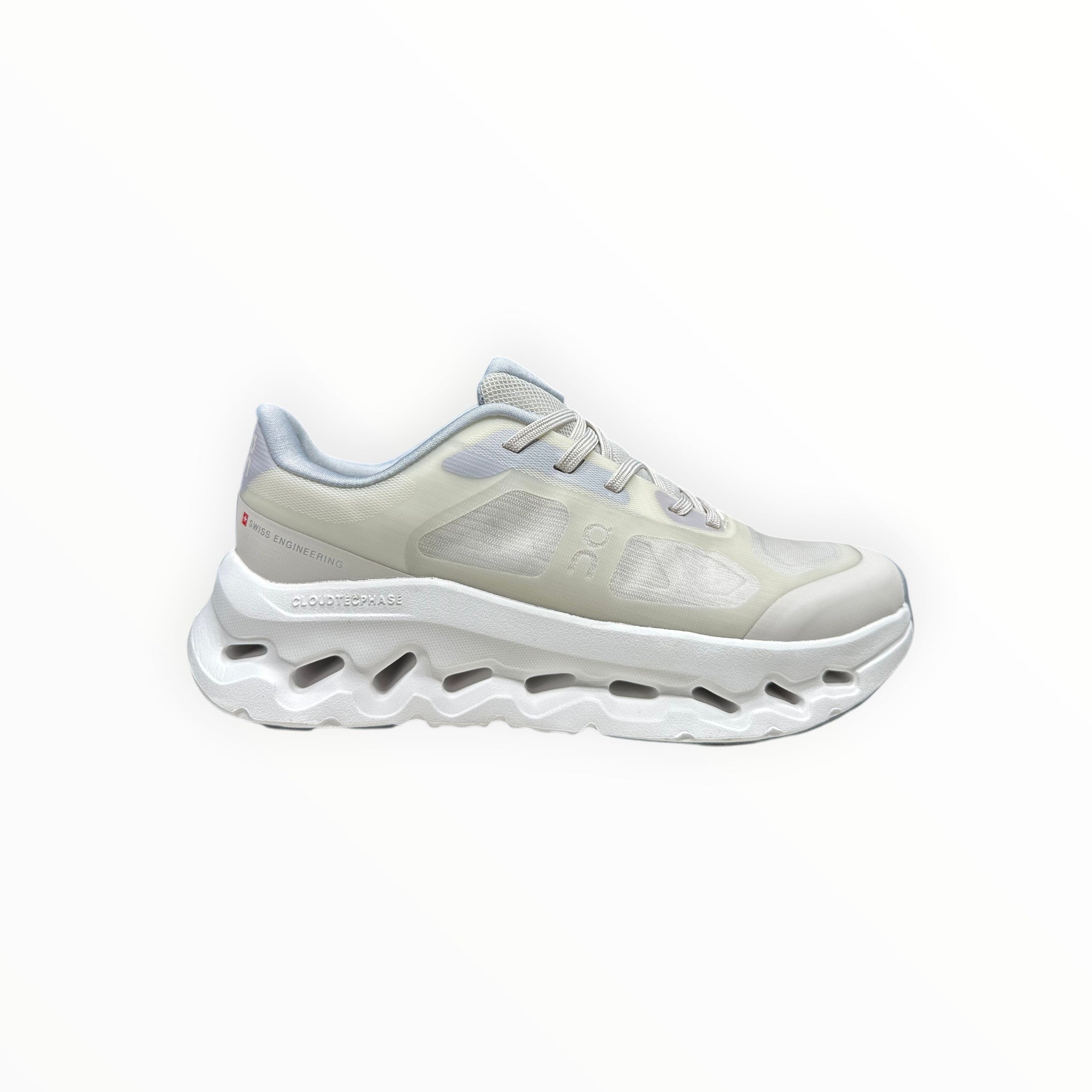 EWW Sports Shoes On Cloudtilt Remix cream sneakers with layered see-through upper and white sculpted sole.