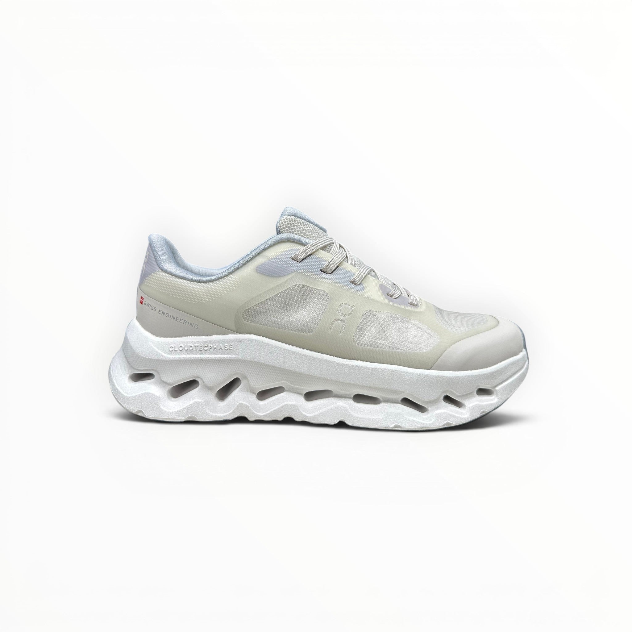 EWW Sports Shoes On Cloudtilt Remix cream sneakers with layered see-through upper and white sculpted sole.
