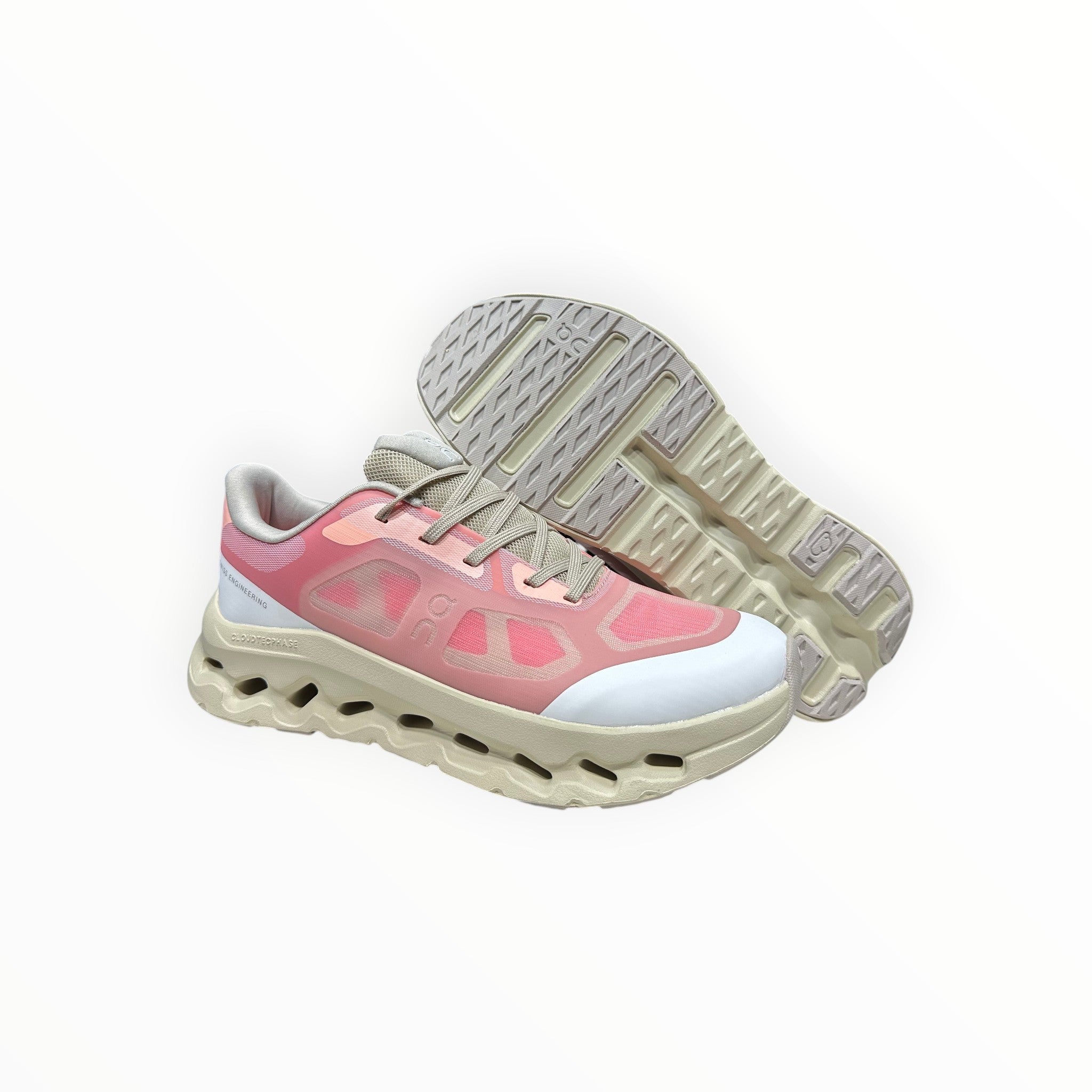 EWW Sports Shoes On Cloudtilt Remix pink and cream sneakers with a transparent layered upper and chunky sole.
